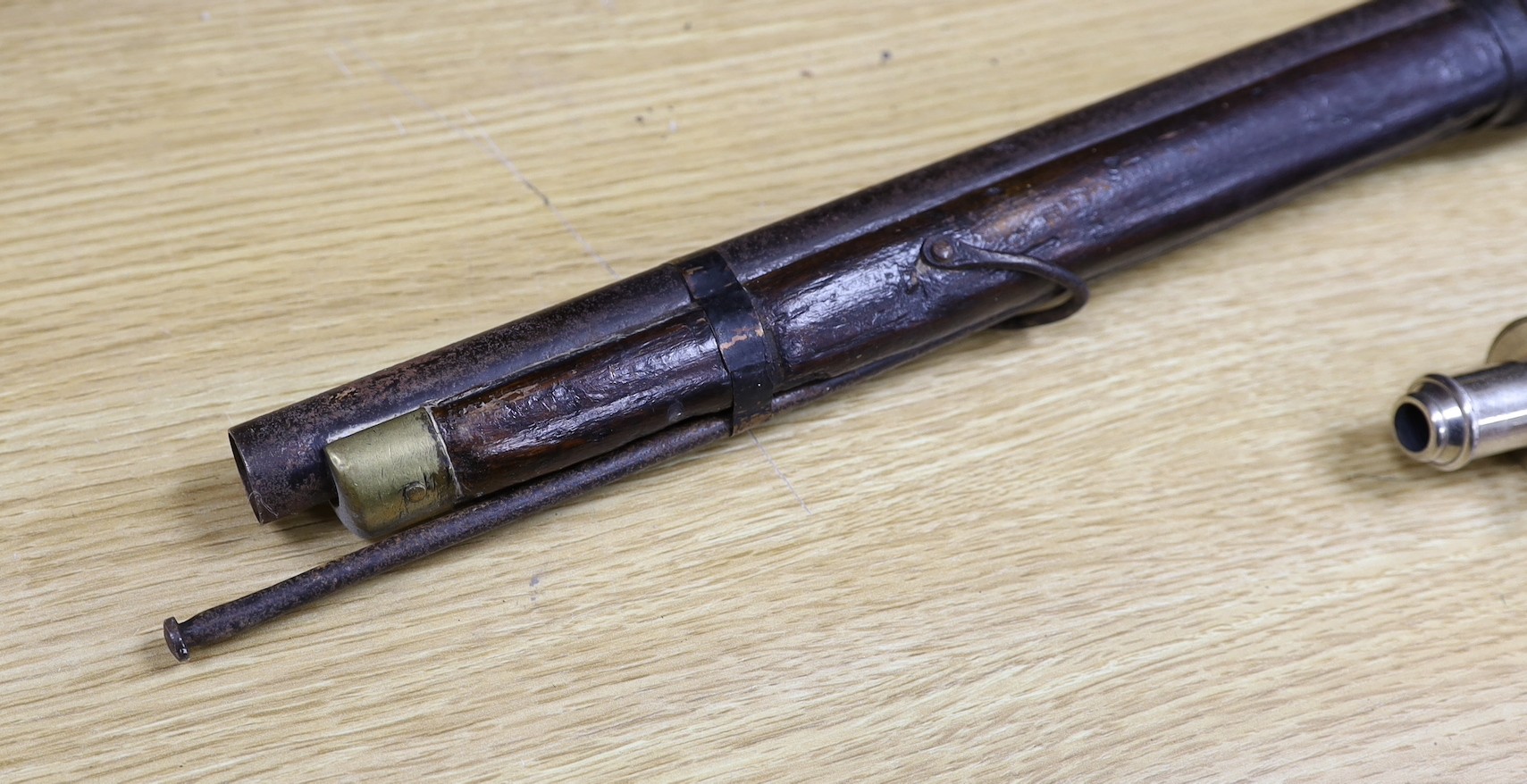 A 19th century percussion cap carbine musket with name stamped to lock plate and a shot flask, musket 94cms long